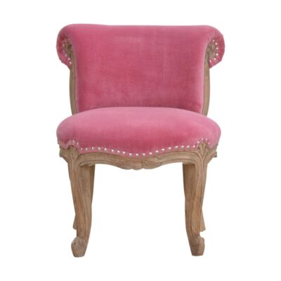Rosafarbener, mit Samt besetzter Stuhl