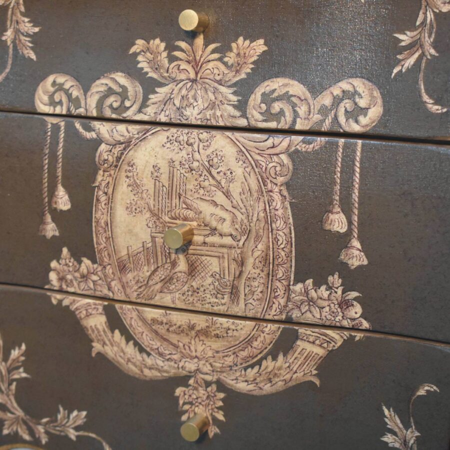 Antique-style painted drawer with decorative floral motif.
