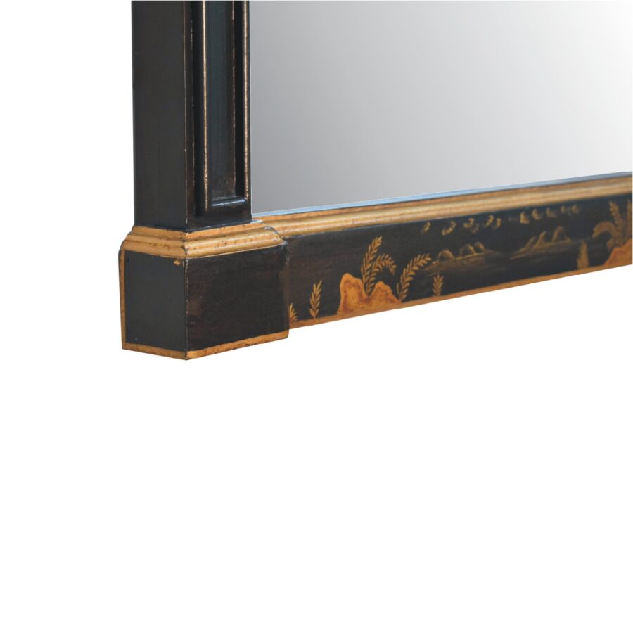 Antique mirror with decorative gold-painted frame.
