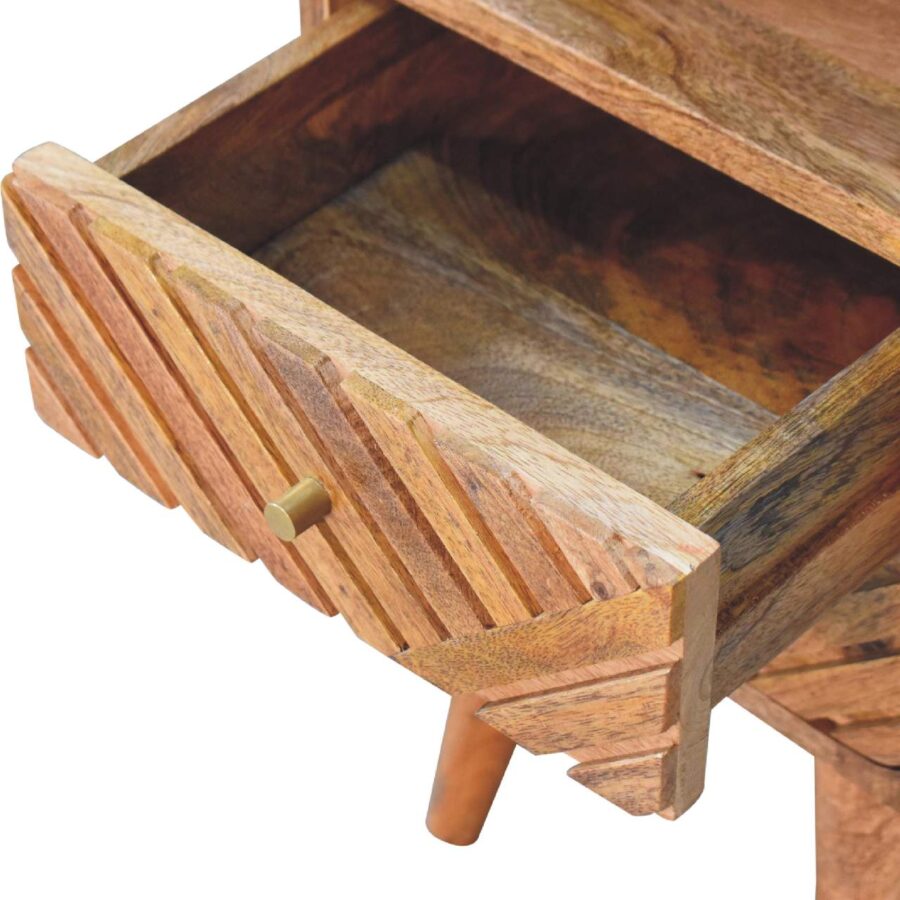 Open wooden drawer detail.