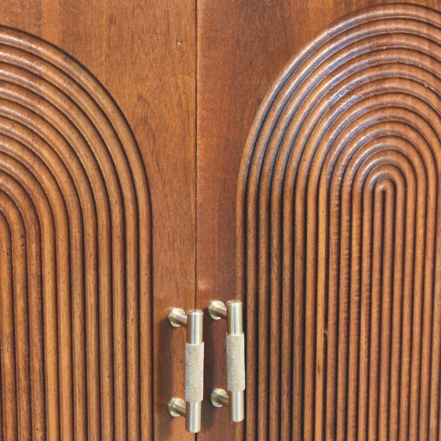 Wooden cabinet doors with metal handles.