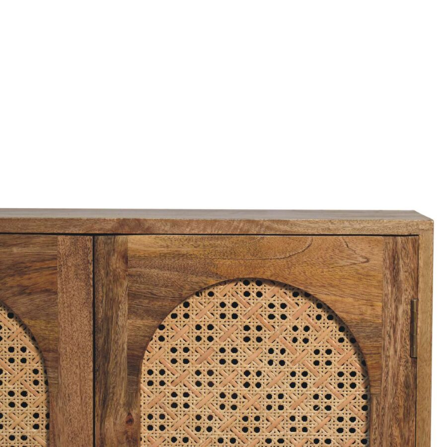 Carved wooden sideboard with decorative panels.
