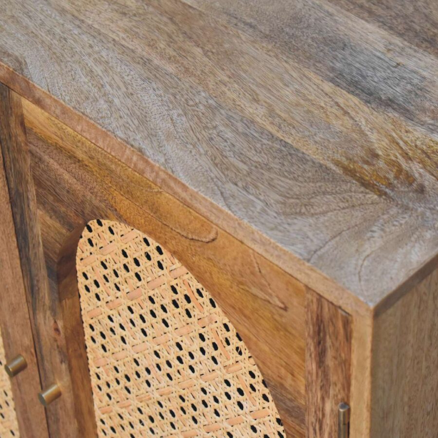 Wooden cabinet with cane details.