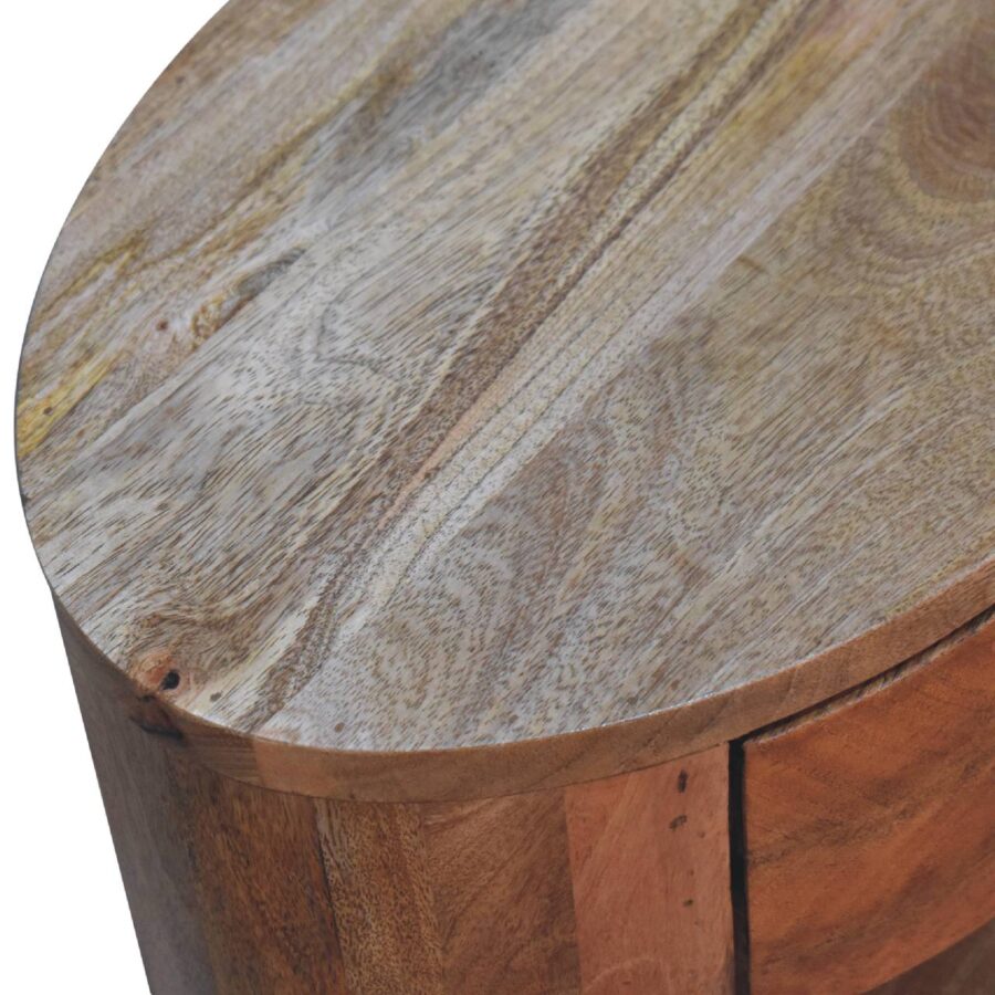 Round wooden table top, textured grain detail.