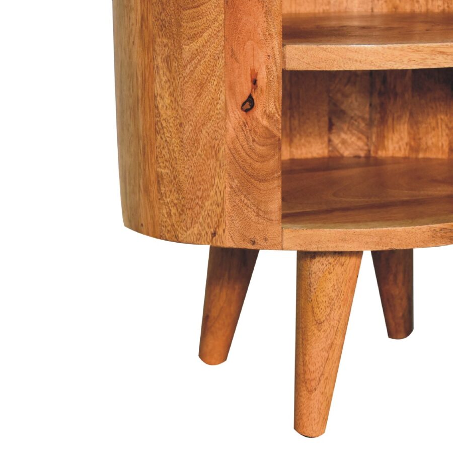 Wooden bedside table with round corners and shelf.