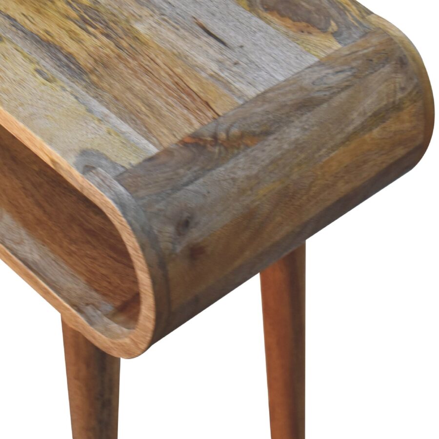 Wooden trough on legs, rustic texture, close-up view.