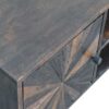 Wooden cabinet with geometric drawer design.