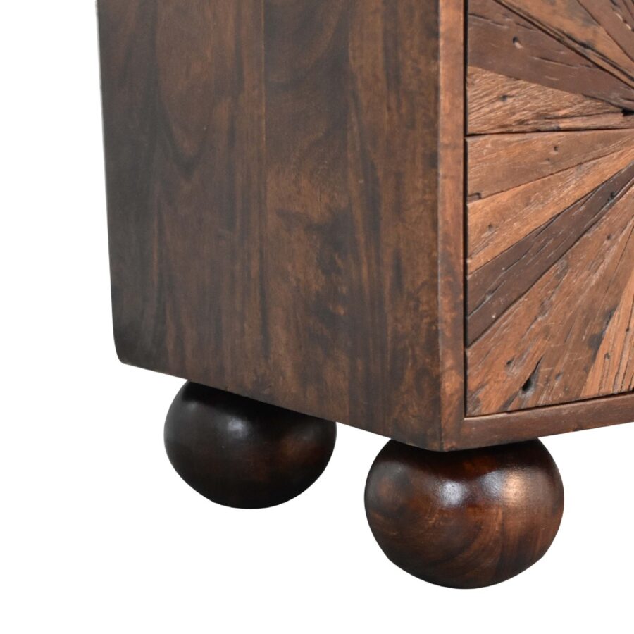 Wooden cabinet with spherical feet detail.