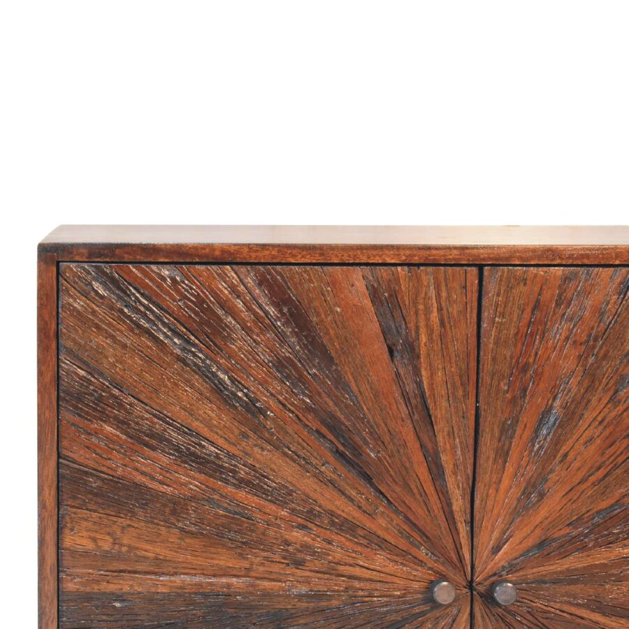 Wooden cabinet with sunburst pattern design.