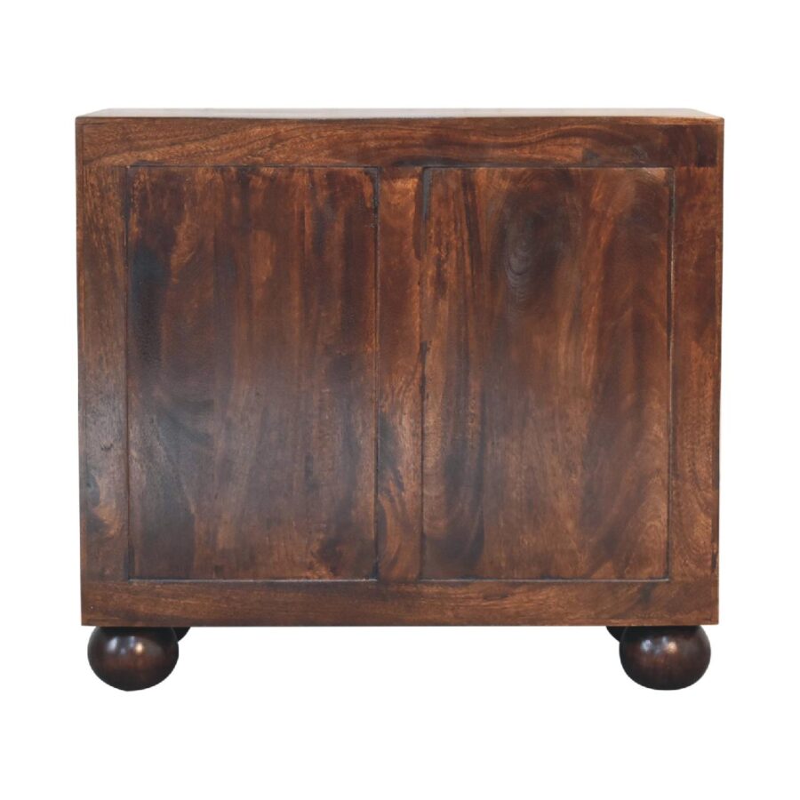 Wooden cabinet on round feet isolated on white.