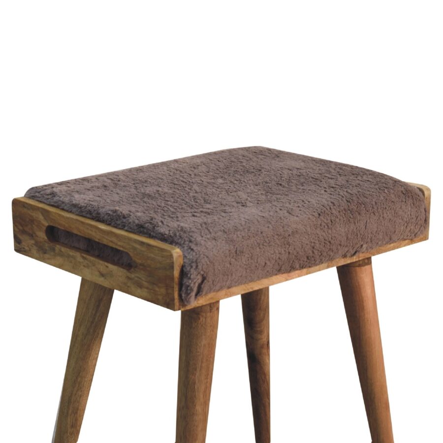 Wooden stool with brown cushion top.