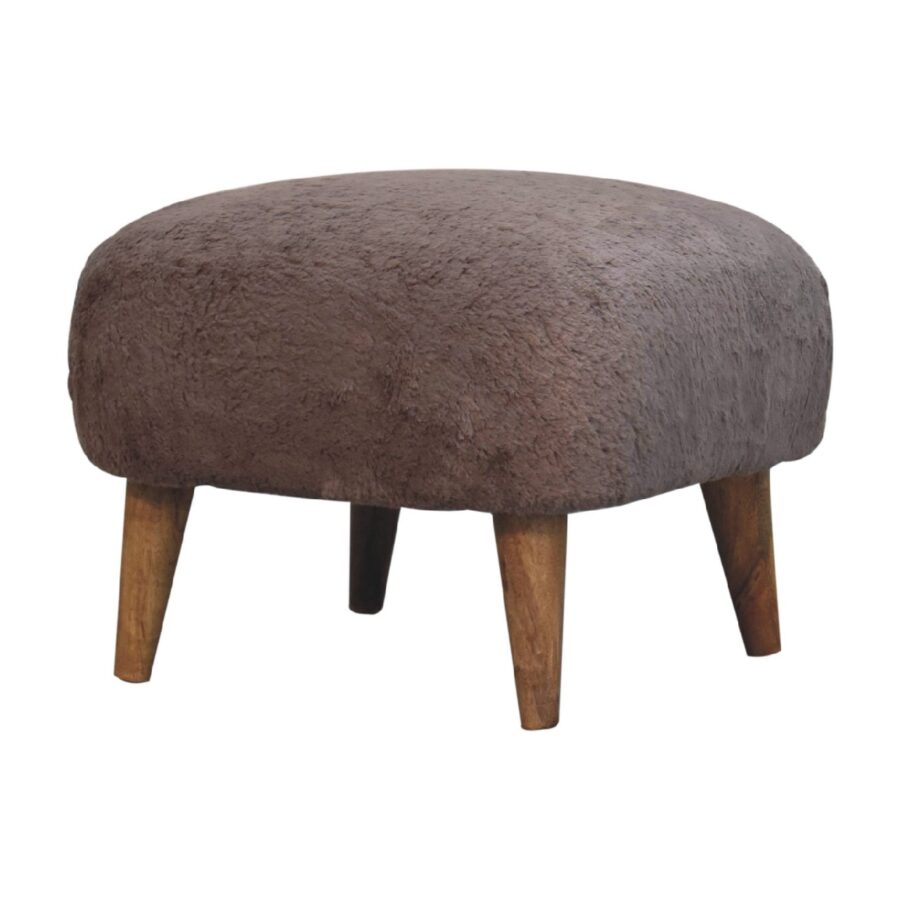 Brown upholstered round footstool on wooden legs.