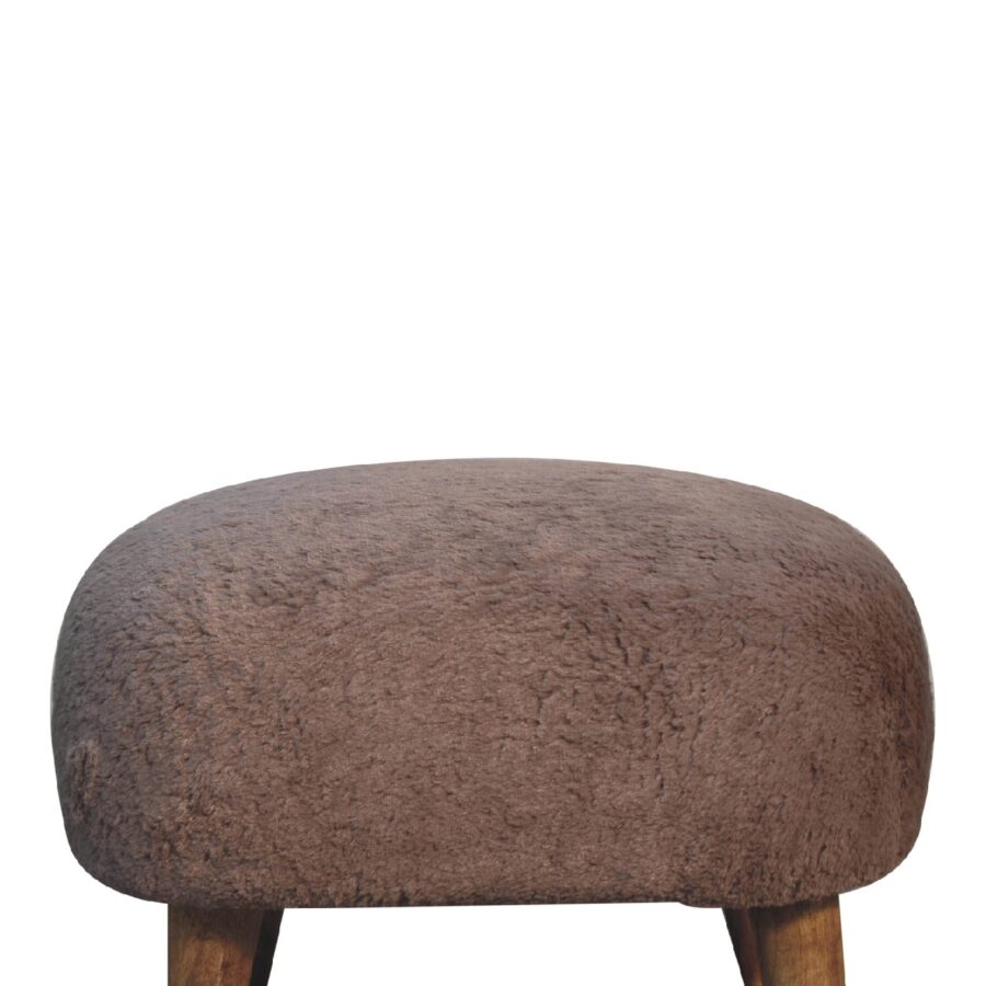 Brown fabric ottoman on white background.