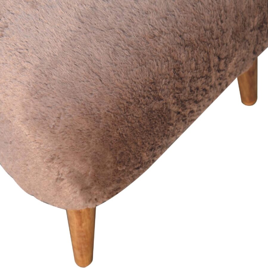 Brown upholstered ottoman with wooden legs