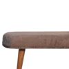 Close-up of brown upholstered vintage table edge.
