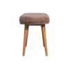 Wooden stool with brown cushion on white background.