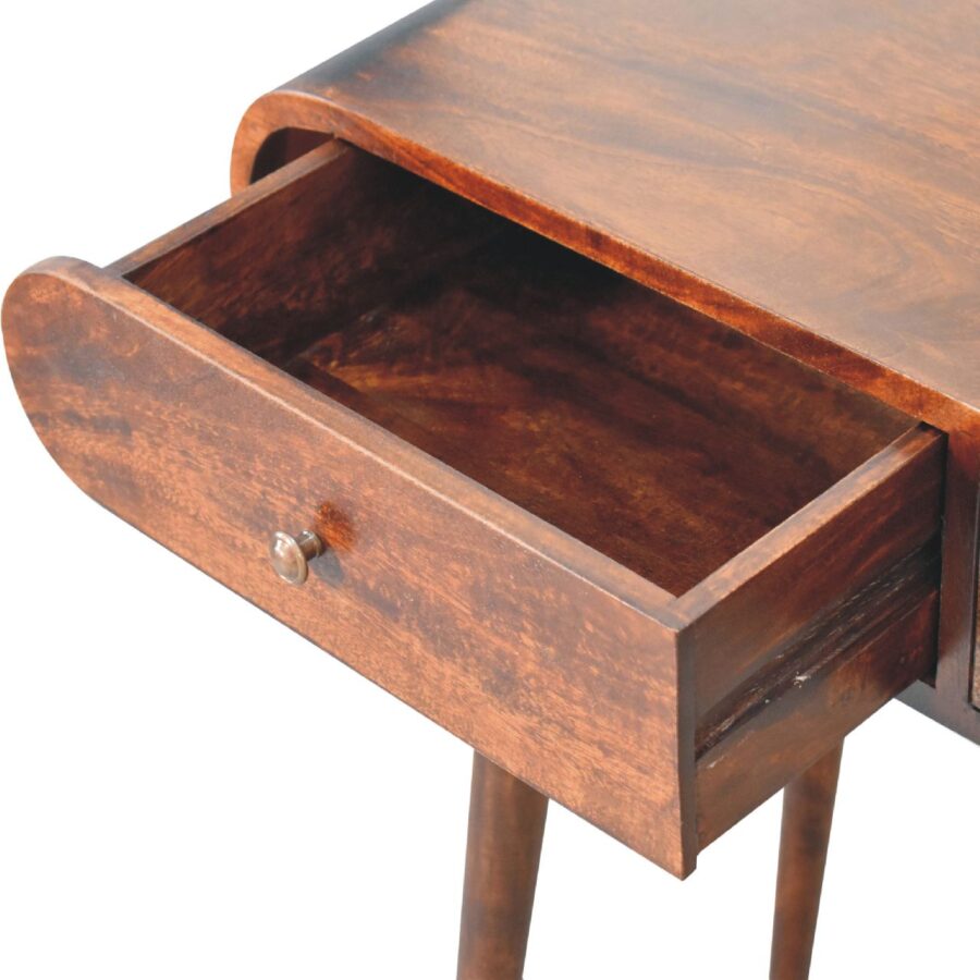 Open wooden drawer in brown writing desk.