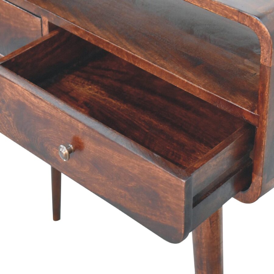 Vintage wooden desk with open drawer.