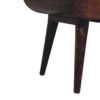 Wooden chair leg detail on white background.