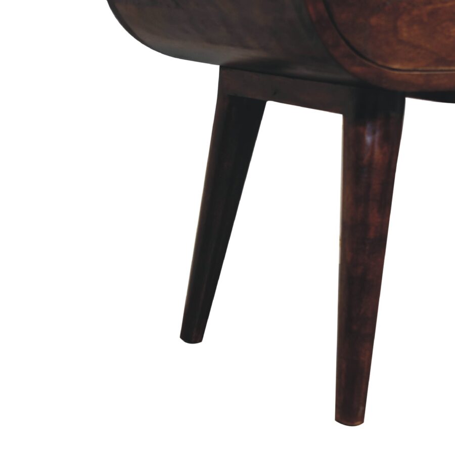 Wooden chair leg detail on white background.