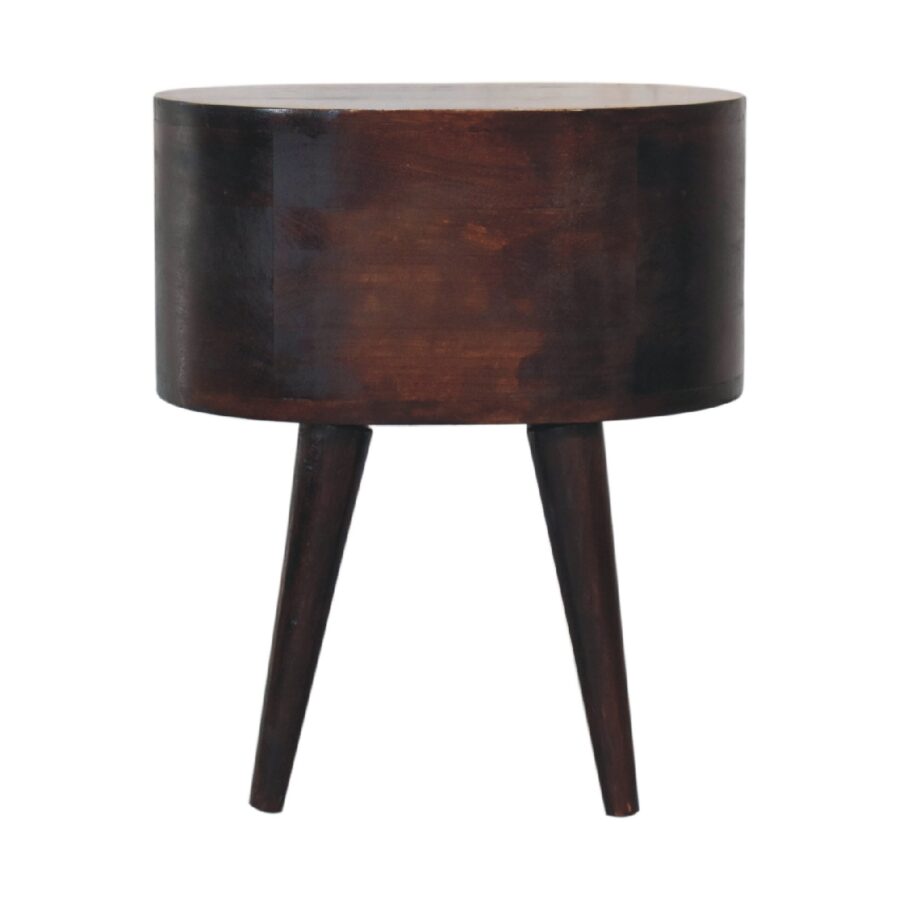 Dark wooden round bedside table with tapered legs.