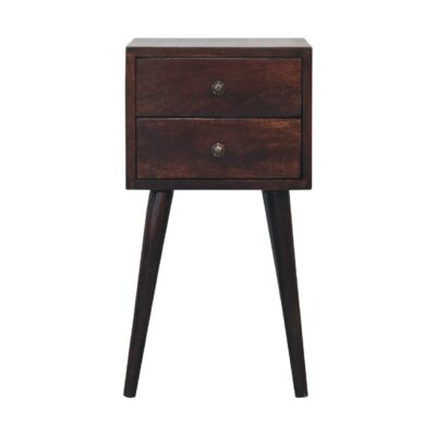 Vintage wooden bedside table with drawers on white background.