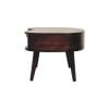 Vintage round wooden side table on white background.