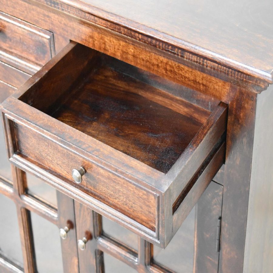 Open wooden drawer in brown vintage cabinet