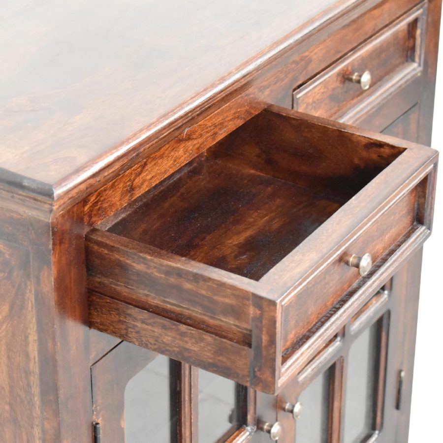 Open wooden drawer on antique desk.
