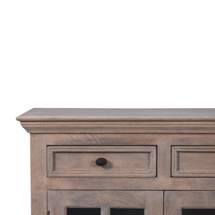 Wooden sideboard with drawers against white background.