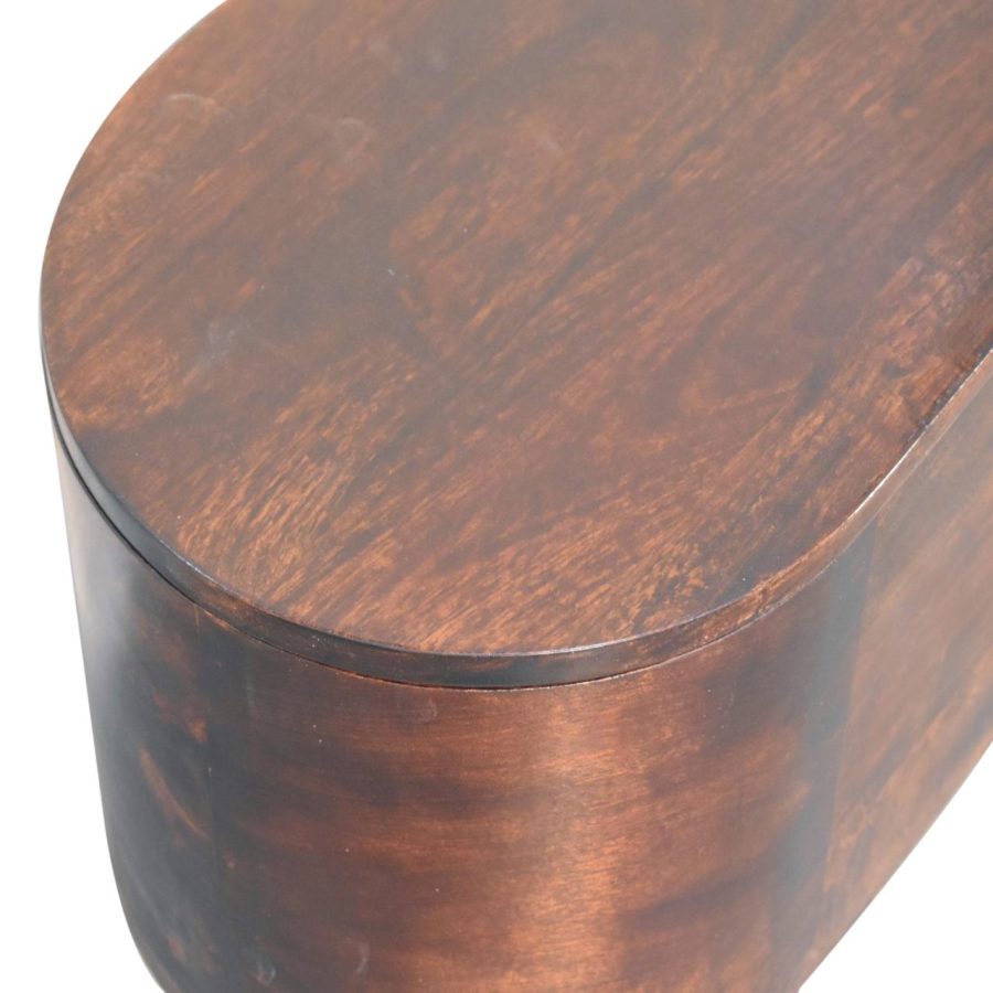 Close-up of wooden oval table corner.