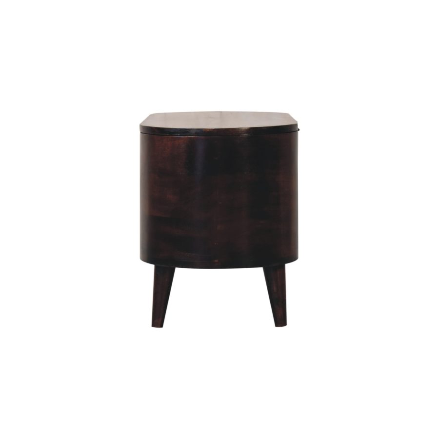 Dark wooden bedside table with round top and legs.