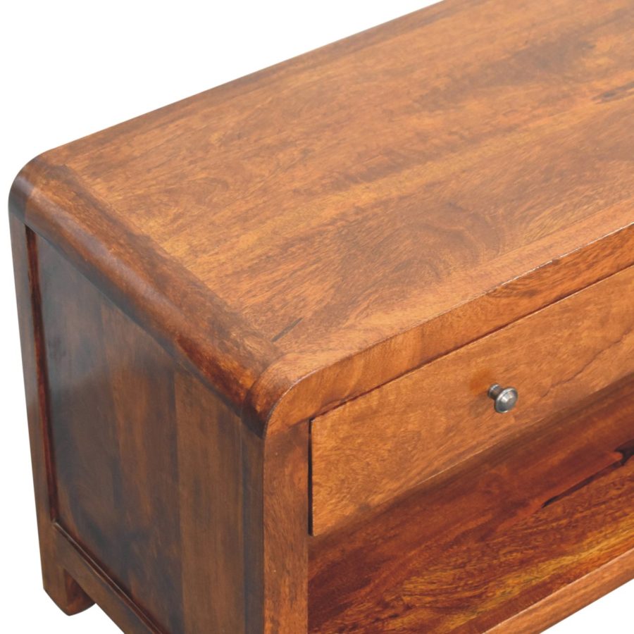 Wooden chest of drawers corner detail.