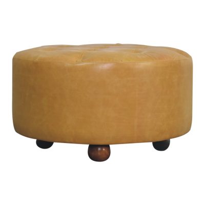 Round tan leather ottoman with wooden feet