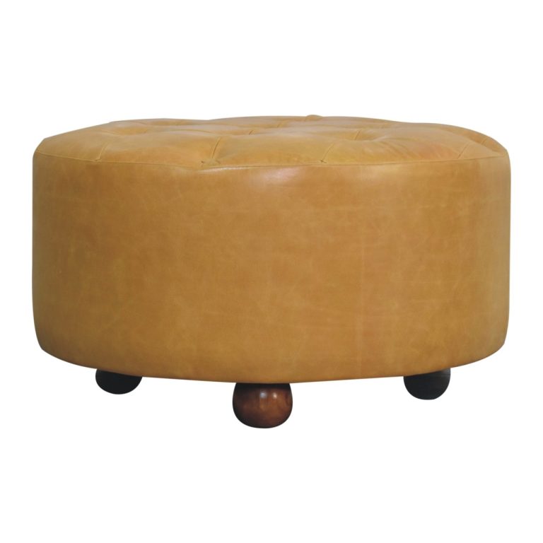 Round tan leather ottoman with wooden feet