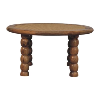 Oval wooden coffee table with woven cane top