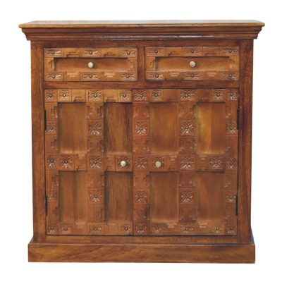 Carved wooden cabinet with panelled doors and drawers